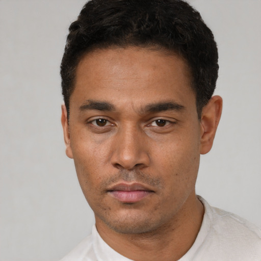 Neutral latino young-adult male with short  black hair and brown eyes