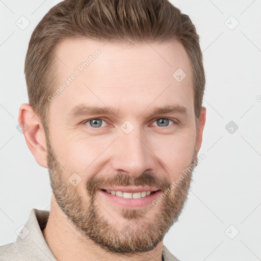 Joyful white young-adult male with short  brown hair and grey eyes