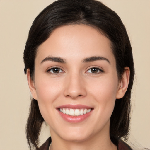 Joyful white young-adult female with medium  brown hair and brown eyes