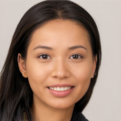 Joyful white young-adult female with long  brown hair and brown eyes