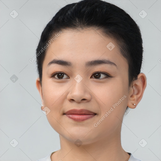 Joyful asian young-adult female with short  black hair and brown eyes