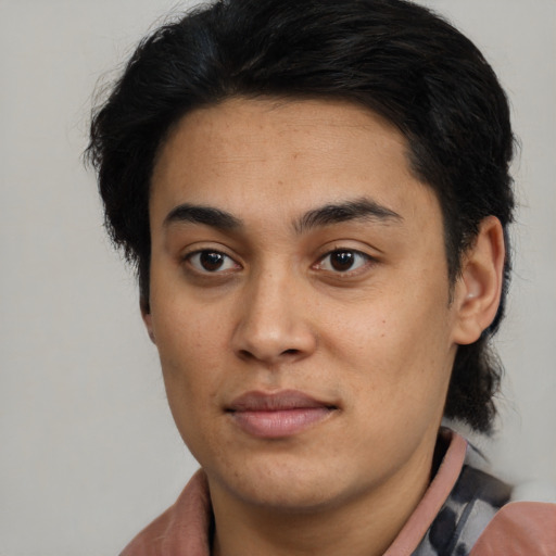 Joyful latino young-adult male with short  brown hair and brown eyes