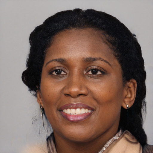 Joyful black adult female with medium  black hair and brown eyes