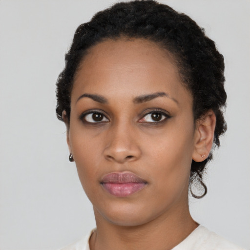 Neutral black young-adult female with short  black hair and brown eyes
