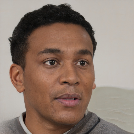 Neutral black adult male with short  brown hair and brown eyes
