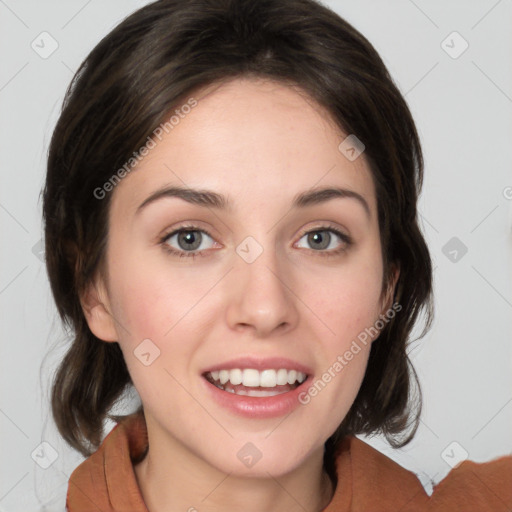 Joyful white young-adult female with medium  brown hair and green eyes