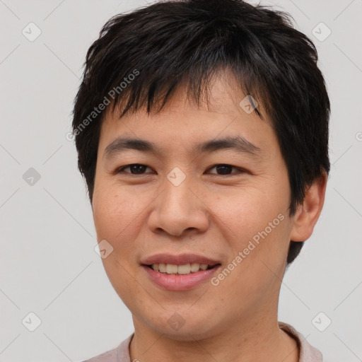 Joyful asian young-adult male with short  brown hair and brown eyes