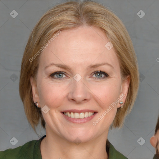 Joyful white young-adult female with medium  brown hair and blue eyes