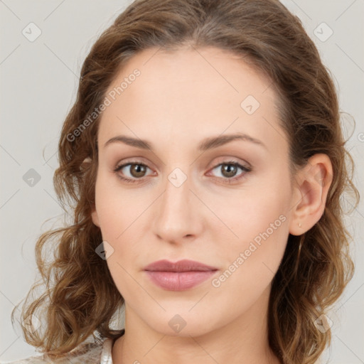 Joyful white young-adult female with long  brown hair and green eyes