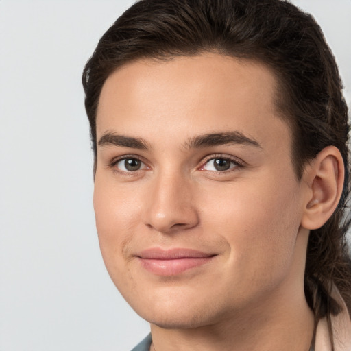 Joyful white young-adult male with medium  brown hair and brown eyes