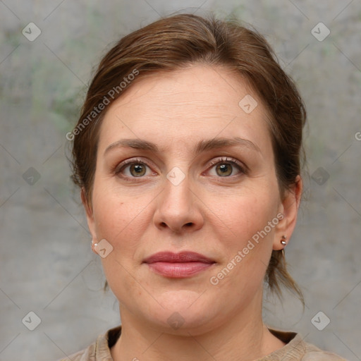 Joyful white adult female with medium  brown hair and grey eyes