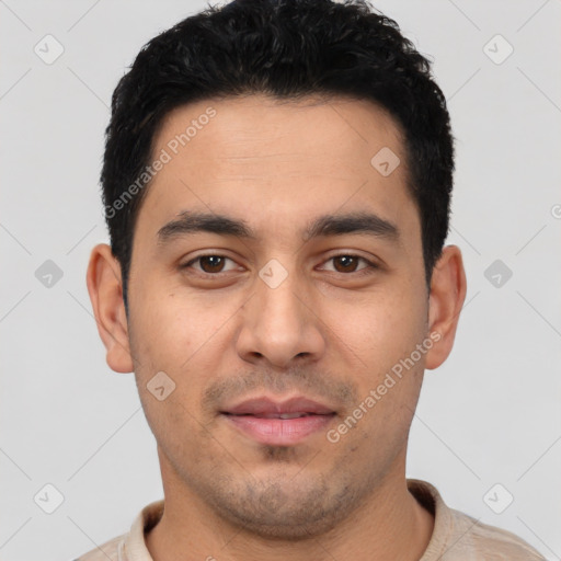 Joyful latino young-adult male with short  black hair and brown eyes