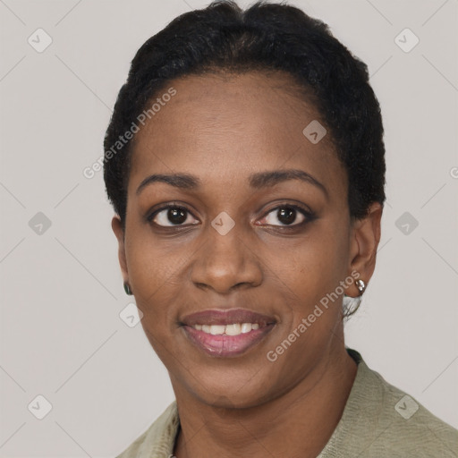 Joyful black young-adult female with short  black hair and brown eyes