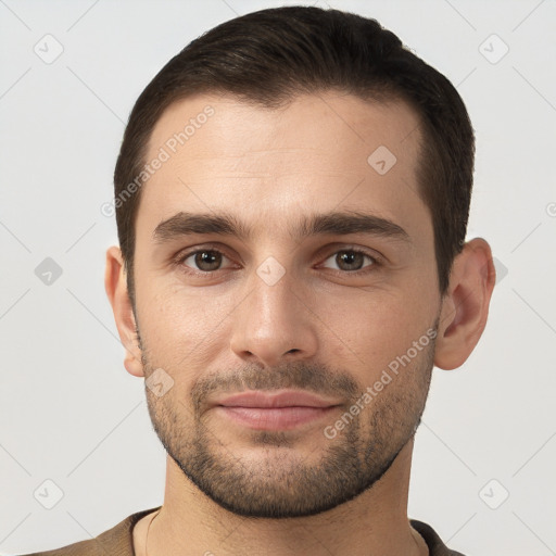 Joyful white young-adult male with short  brown hair and brown eyes