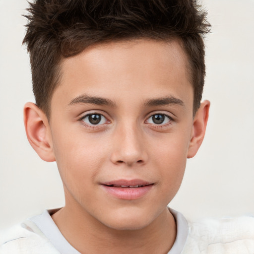 Joyful white child male with short  brown hair and brown eyes