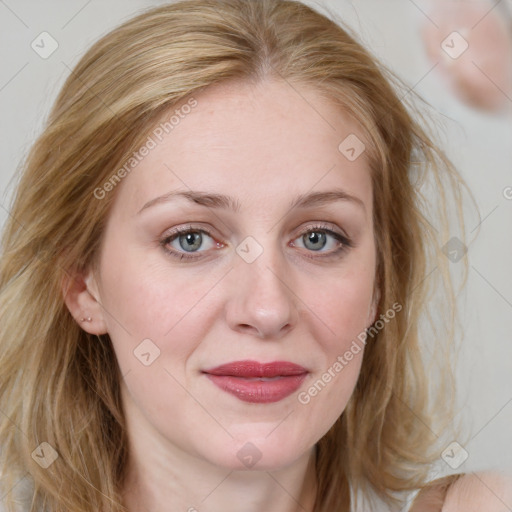 Joyful white adult female with medium  brown hair and blue eyes