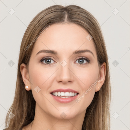 Joyful white young-adult female with long  brown hair and grey eyes