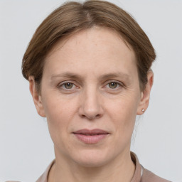 Joyful white adult female with short  brown hair and grey eyes