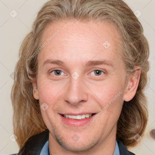 Joyful white young-adult female with medium  brown hair and blue eyes