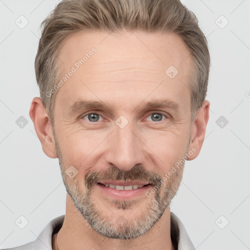 Joyful white adult male with short  brown hair and grey eyes