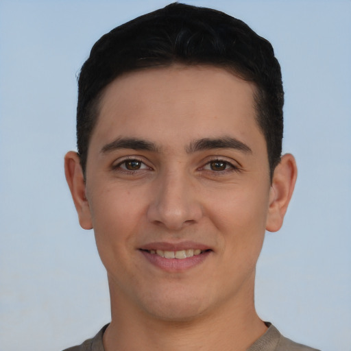 Joyful white young-adult male with short  brown hair and brown eyes
