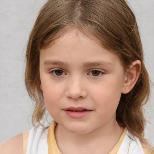 Joyful white child female with medium  brown hair and brown eyes