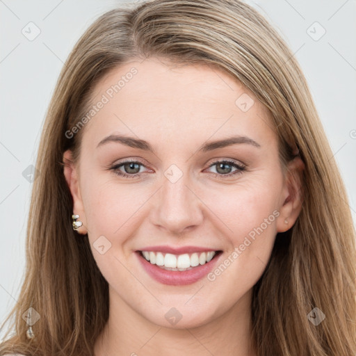 Joyful white young-adult female with long  brown hair and grey eyes