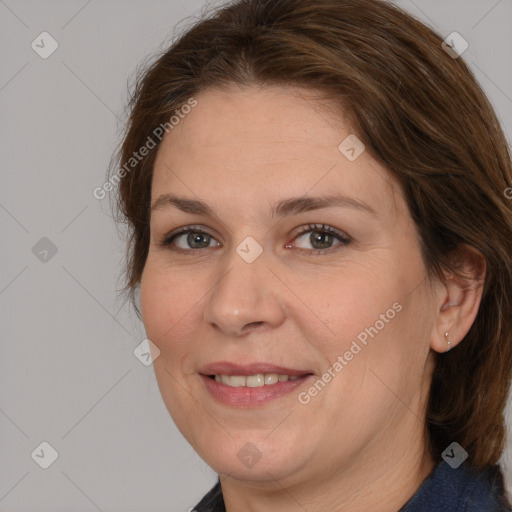 Joyful white adult female with medium  brown hair and grey eyes