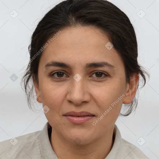 Joyful white adult female with medium  brown hair and brown eyes