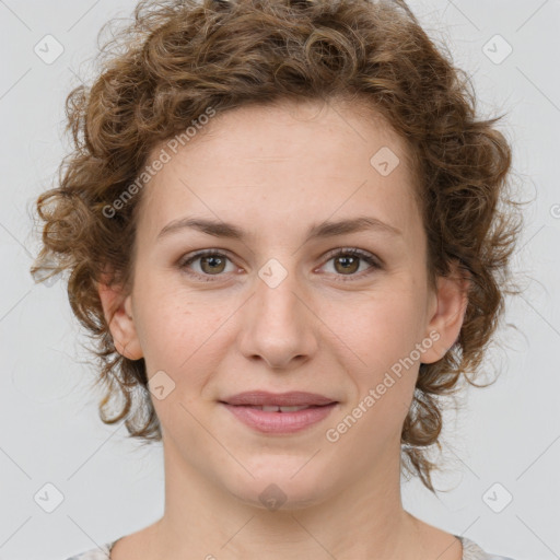 Joyful white young-adult female with medium  brown hair and green eyes