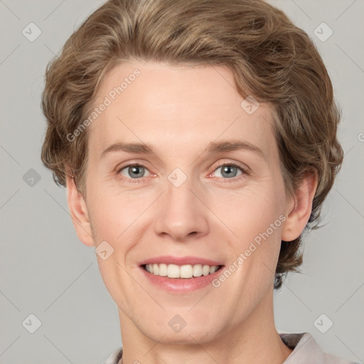 Joyful white adult female with short  brown hair and grey eyes