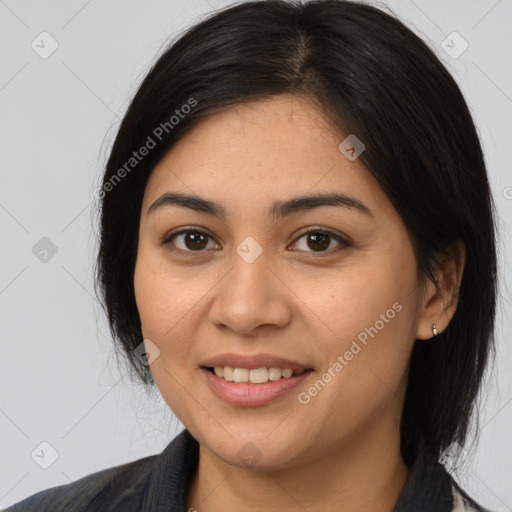 Joyful latino young-adult female with medium  brown hair and brown eyes