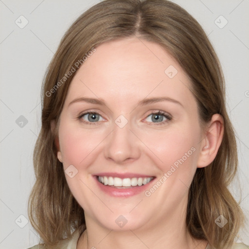 Joyful white young-adult female with medium  brown hair and green eyes