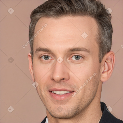 Joyful white adult male with short  brown hair and brown eyes