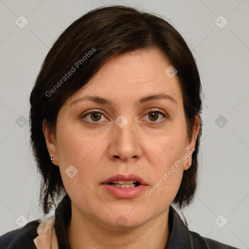 Joyful white adult female with medium  brown hair and brown eyes