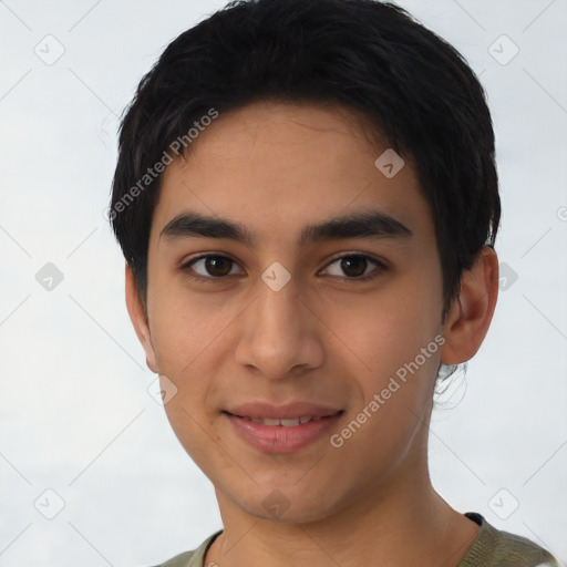 Joyful latino young-adult male with short  black hair and brown eyes