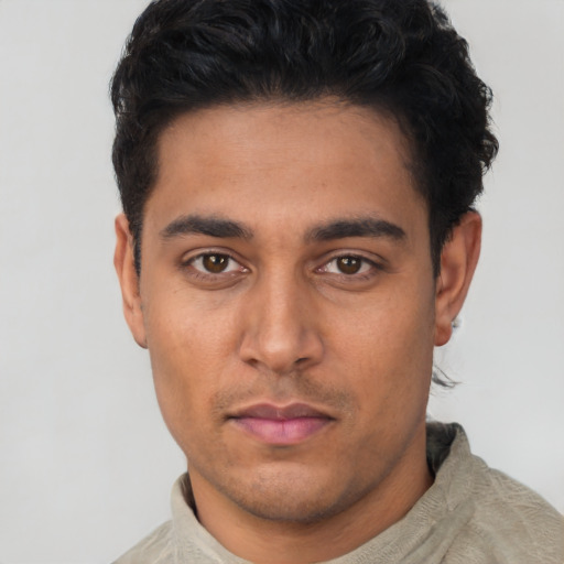 Neutral latino young-adult male with short  black hair and brown eyes