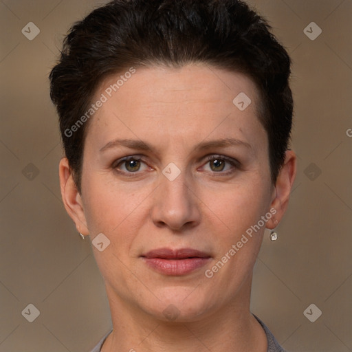 Joyful white adult female with short  brown hair and brown eyes