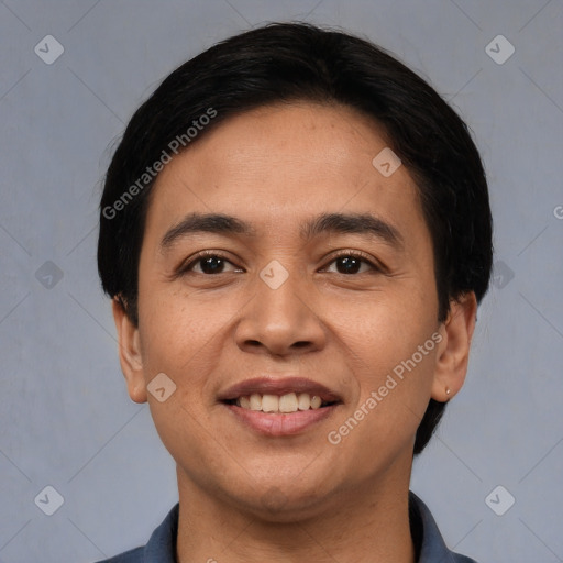 Joyful white young-adult male with short  black hair and brown eyes