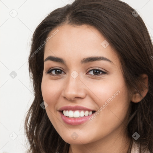 Joyful white young-adult female with long  brown hair and brown eyes