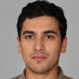 Neutral white young-adult male with short  black hair and brown eyes