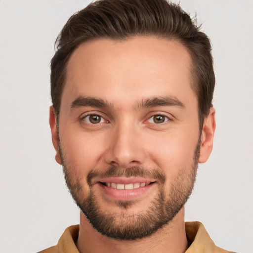 Joyful white young-adult male with short  brown hair and brown eyes