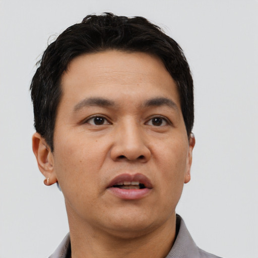 Neutral asian adult male with short  black hair and brown eyes