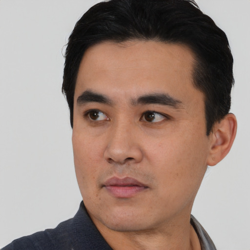 Neutral asian young-adult male with short  black hair and brown eyes