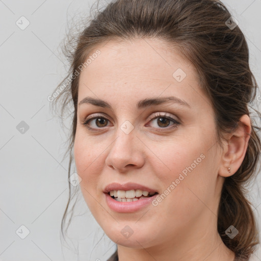 Joyful white young-adult female with medium  brown hair and grey eyes