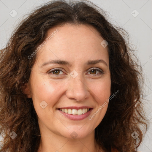 Joyful white adult female with long  brown hair and brown eyes