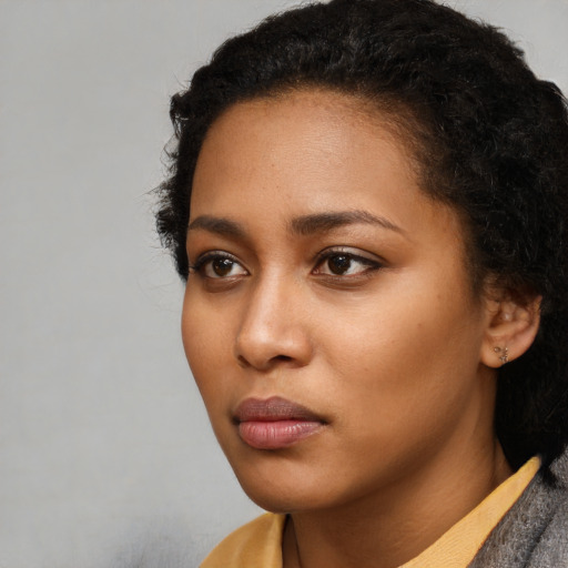 Neutral latino young-adult female with short  black hair and brown eyes