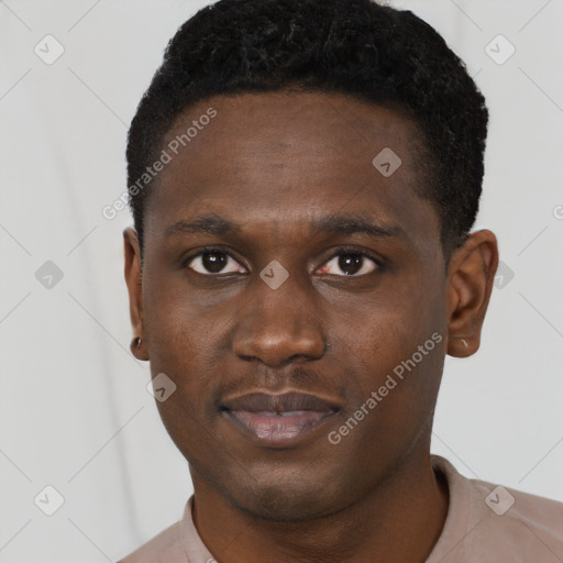 Joyful black young-adult male with short  brown hair and brown eyes
