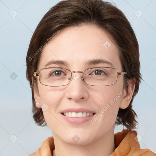 Joyful white young-adult female with medium  brown hair and blue eyes