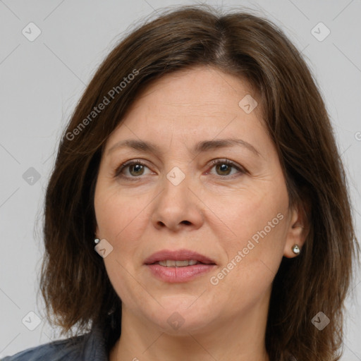 Joyful white adult female with medium  brown hair and brown eyes